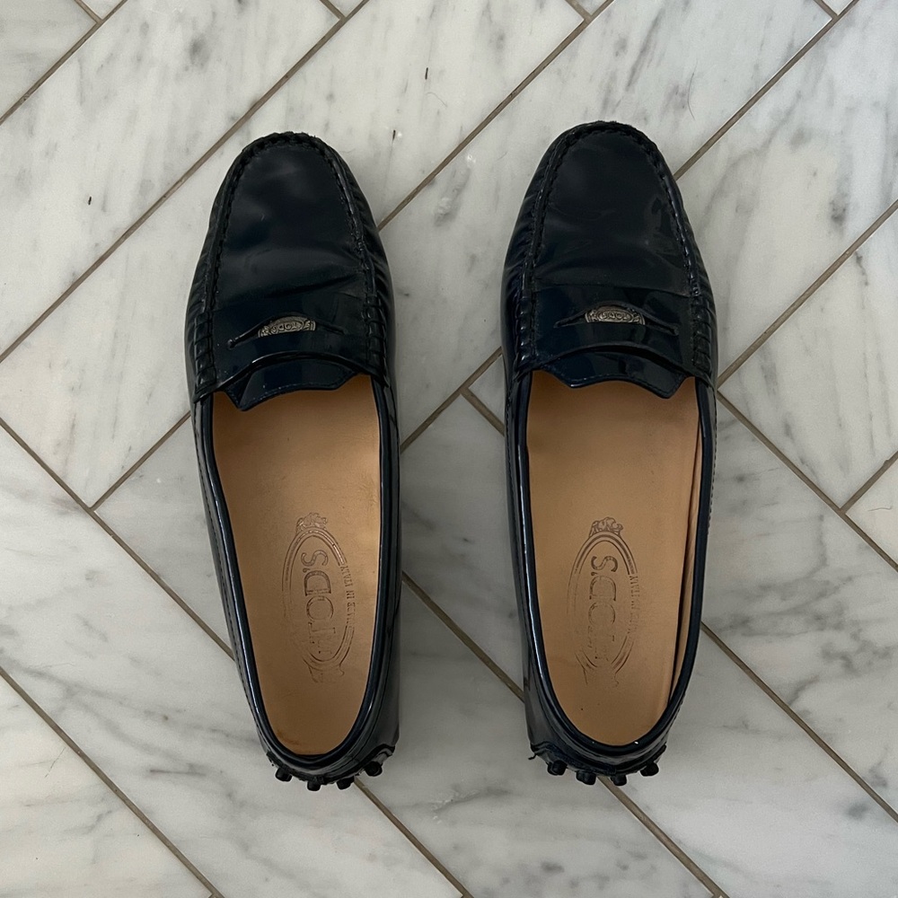 Tod’s navy patent leather driving penny loafers